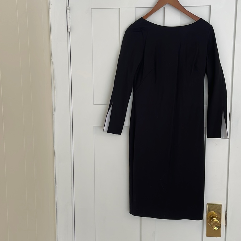 Banana Republic. Knee length black dress with flair!